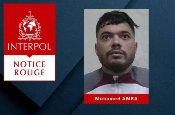 Mohamed Amra en la Alerta Roja emitida el martes por Interpol tras la fuga en el norte de Francia./AFP ,image_description: